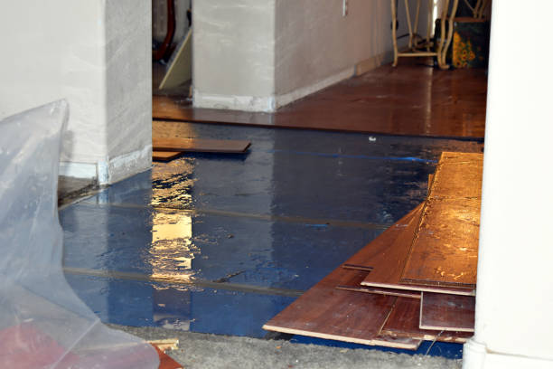 Professional Flood Damage Restoration technician working in Rensselaer, NY